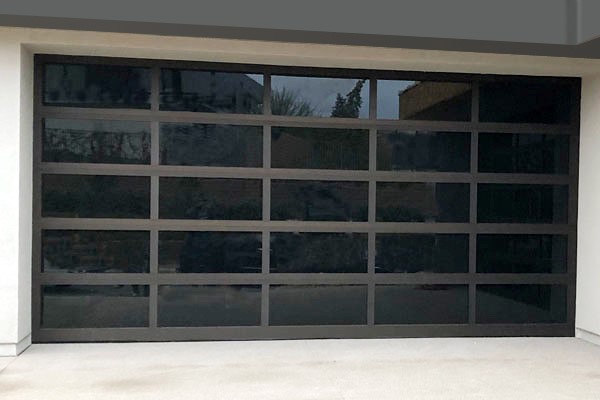 Bronze frame with black windows full view door
